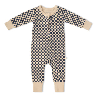 A baby long-sleeve footless romper in a navy and beige checkerboard pattern, featuring solid beige ribbed cuffs and foot cuffs, laid flat on a white background.