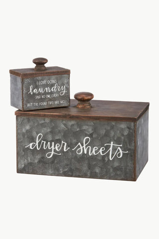 Metal dryer sheets container with rustic design and text on a white background