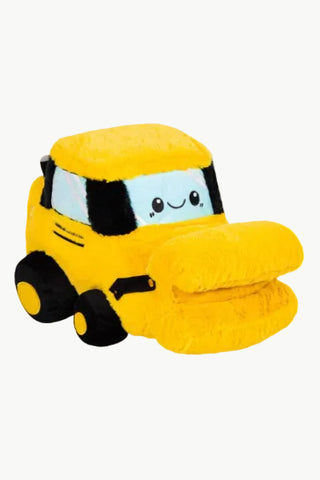 A yellow plush construction vehicle pillow with a smiling face on the windshield, black wheels, and a folded yellow pillow attached to the front, shown on a plain white background.